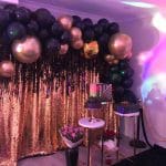 Black and Gold Backdrop with Balloon Garland